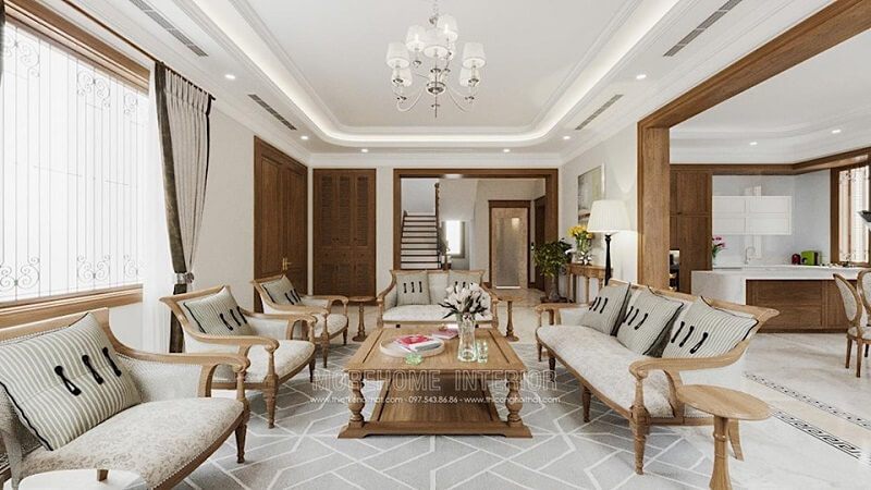 Mẫu bàn trà gỗ tự nhiên màu nâu sáng cùng bộ ghế sofa gỗ sồi ấn tượng tạo điểm nhân cho căn phòng.